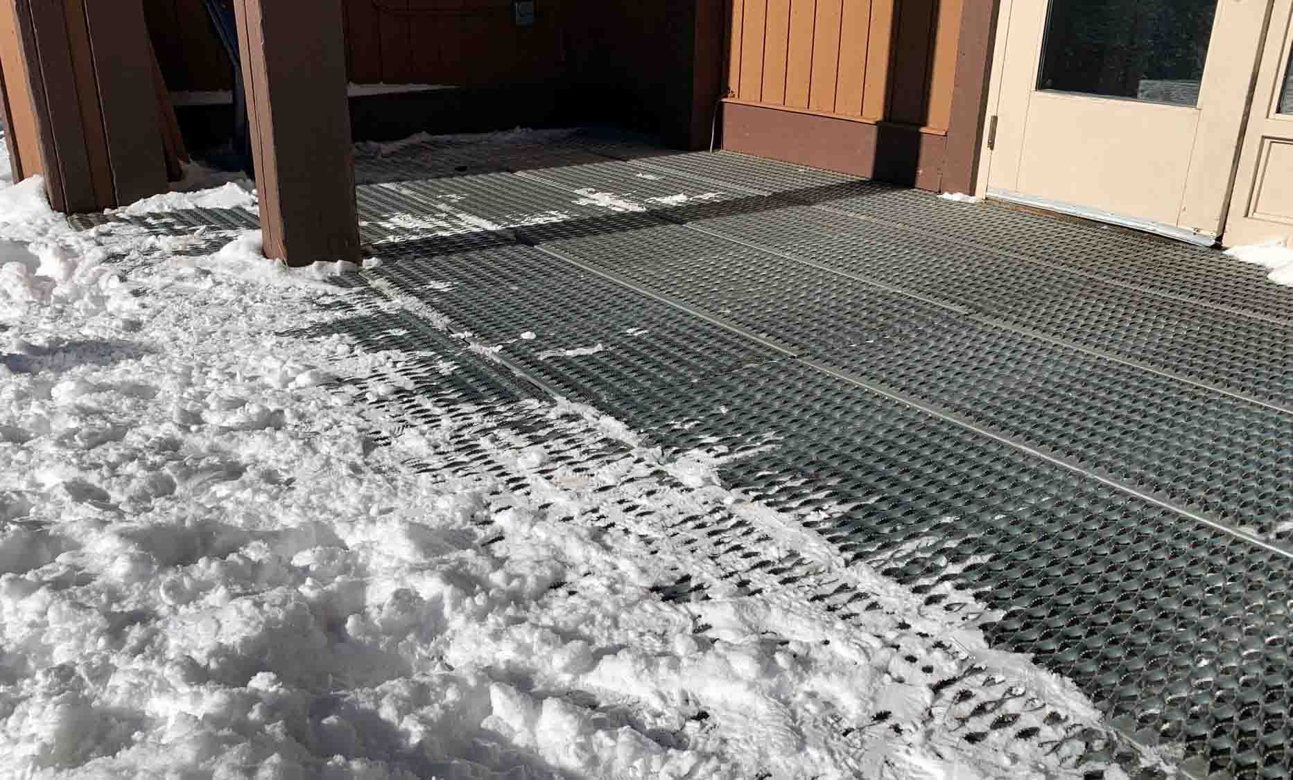 Plank Grating outside the door of a ski lodge in Colorado.
