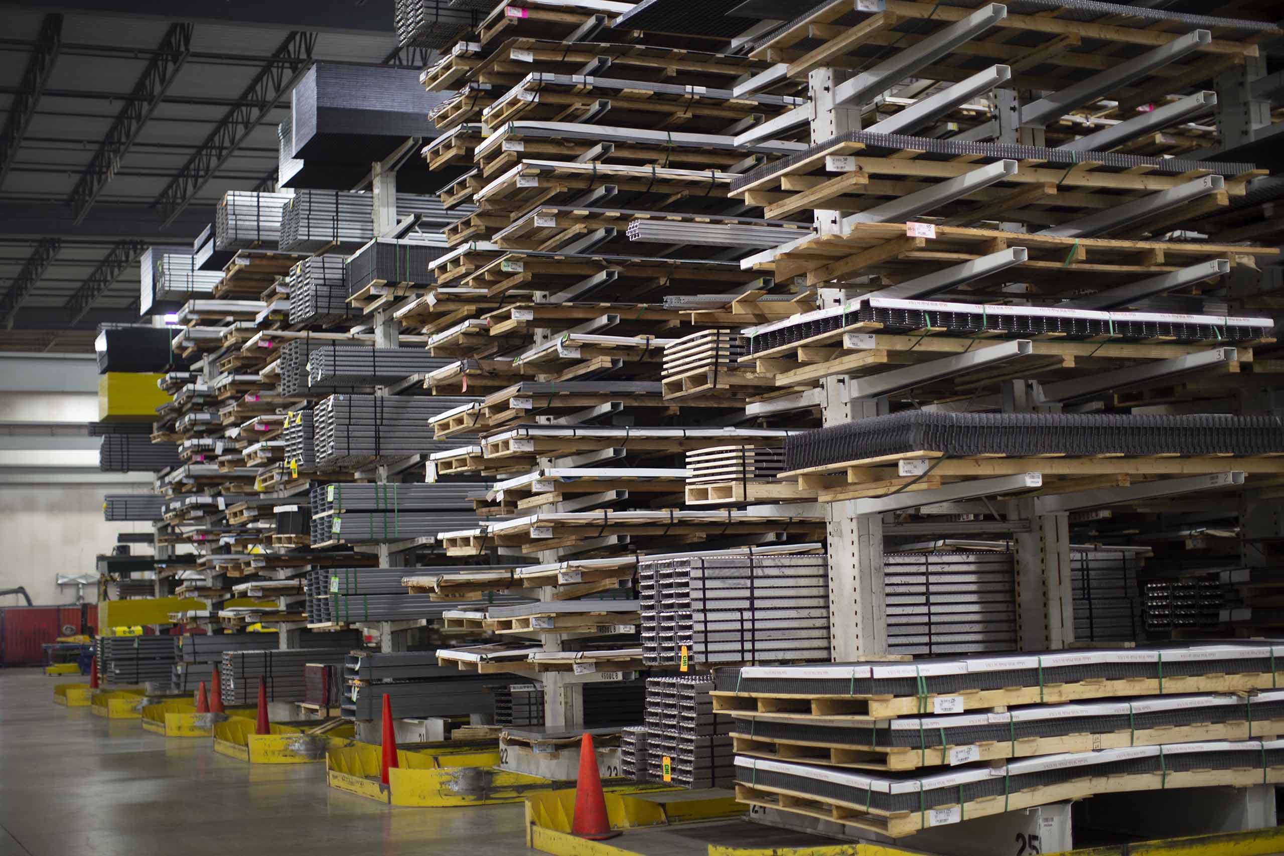 An image of racks of Hole Products inside one of 19 Metals Service Centers that McNICHOLS has.