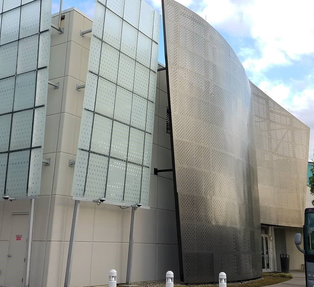 A façade wall of Perforated Metal outside a building at Full Sail University in Orlando, Florida.