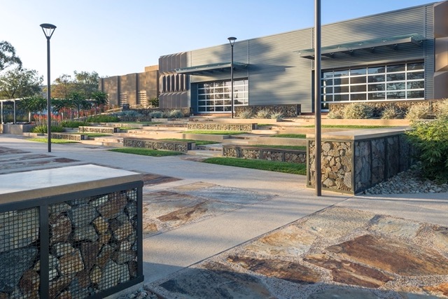 Gabion Baskets made of Wire Mesh used as seating at an outdoor amphitheater.