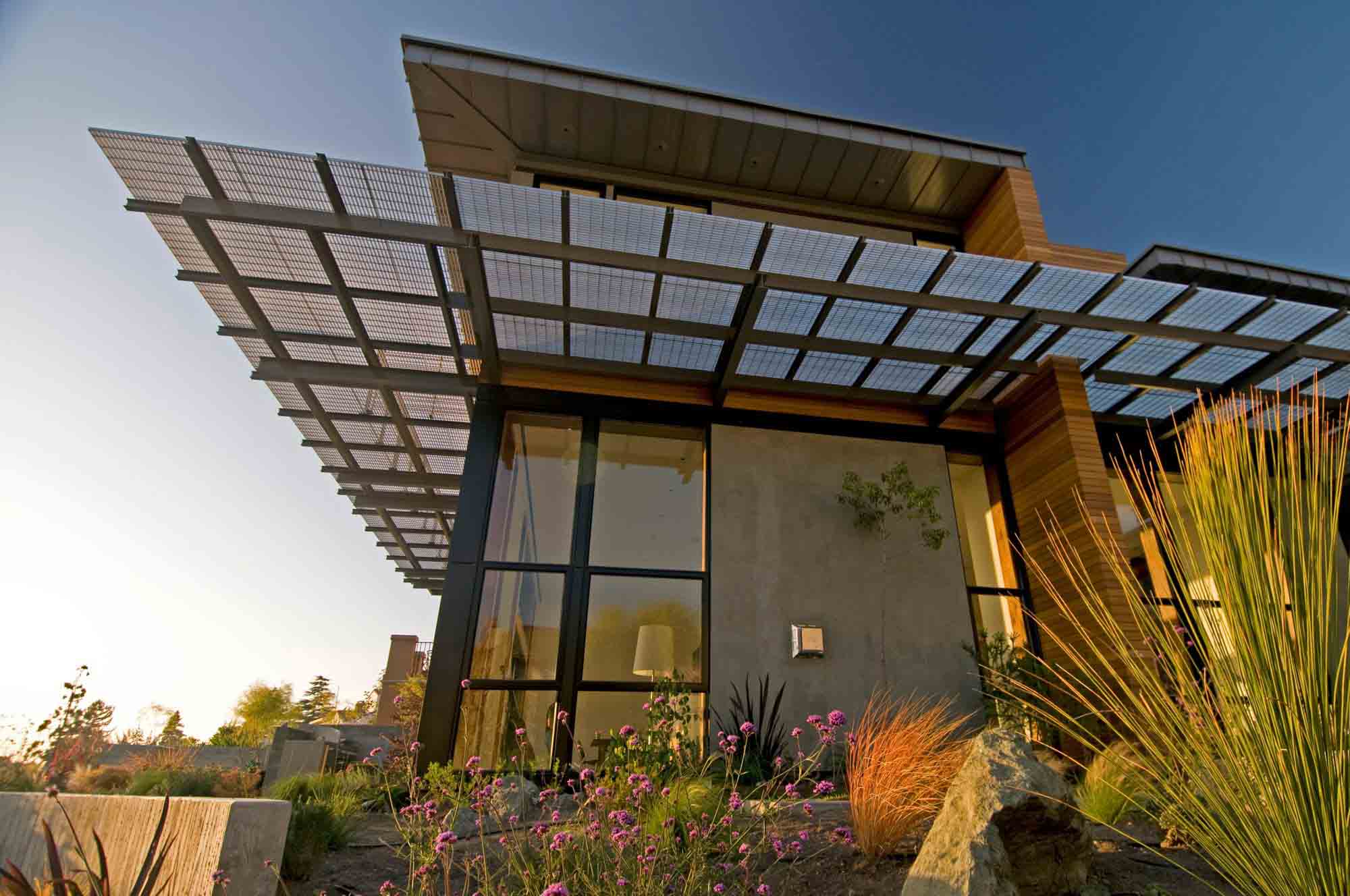 A picture of a known sustainable house that has a Bar Grating overhang.