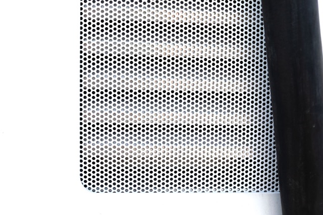 Closeup image of a Perforated Metal insert in an electric vehicle charging station.