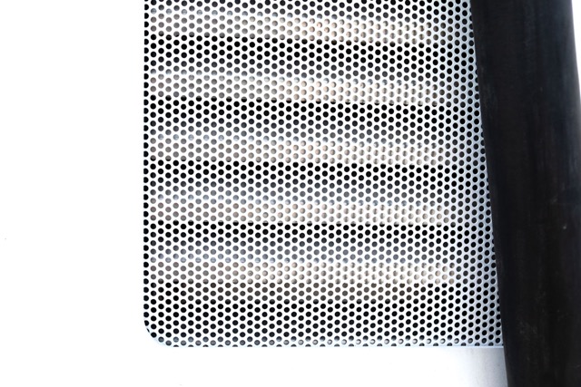 Closeup image of a Perforated Metal insert in an electric vehicle charging station.