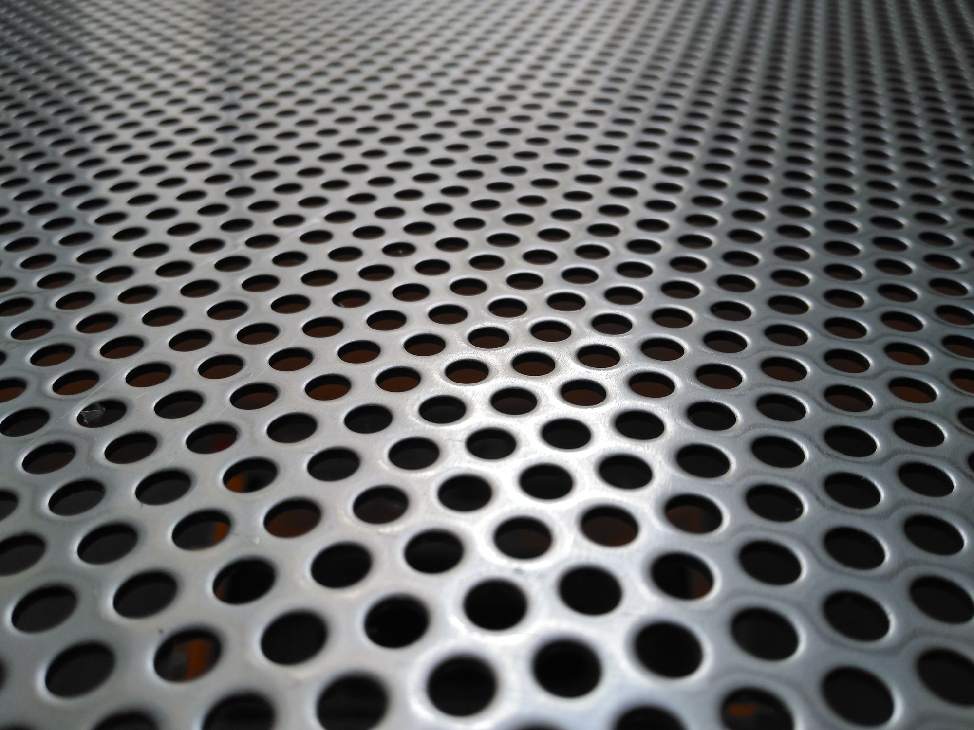 A close-up image of Stainless Steel Round Hole Perforated Metal.
