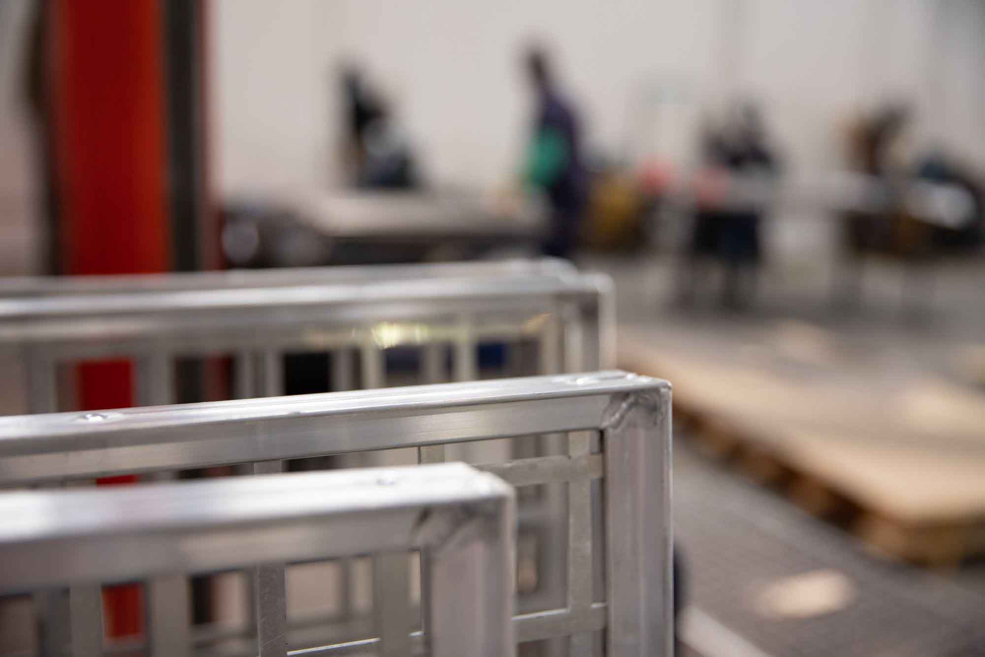 A close-up image of Stainless Steel Square Hole Perforated Infill Panels in one of the McNICHOLS® Metals Service Center location.