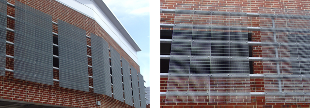 Multiple trim-banded Bar Grating panels that make up a façade on the side of a brick building.