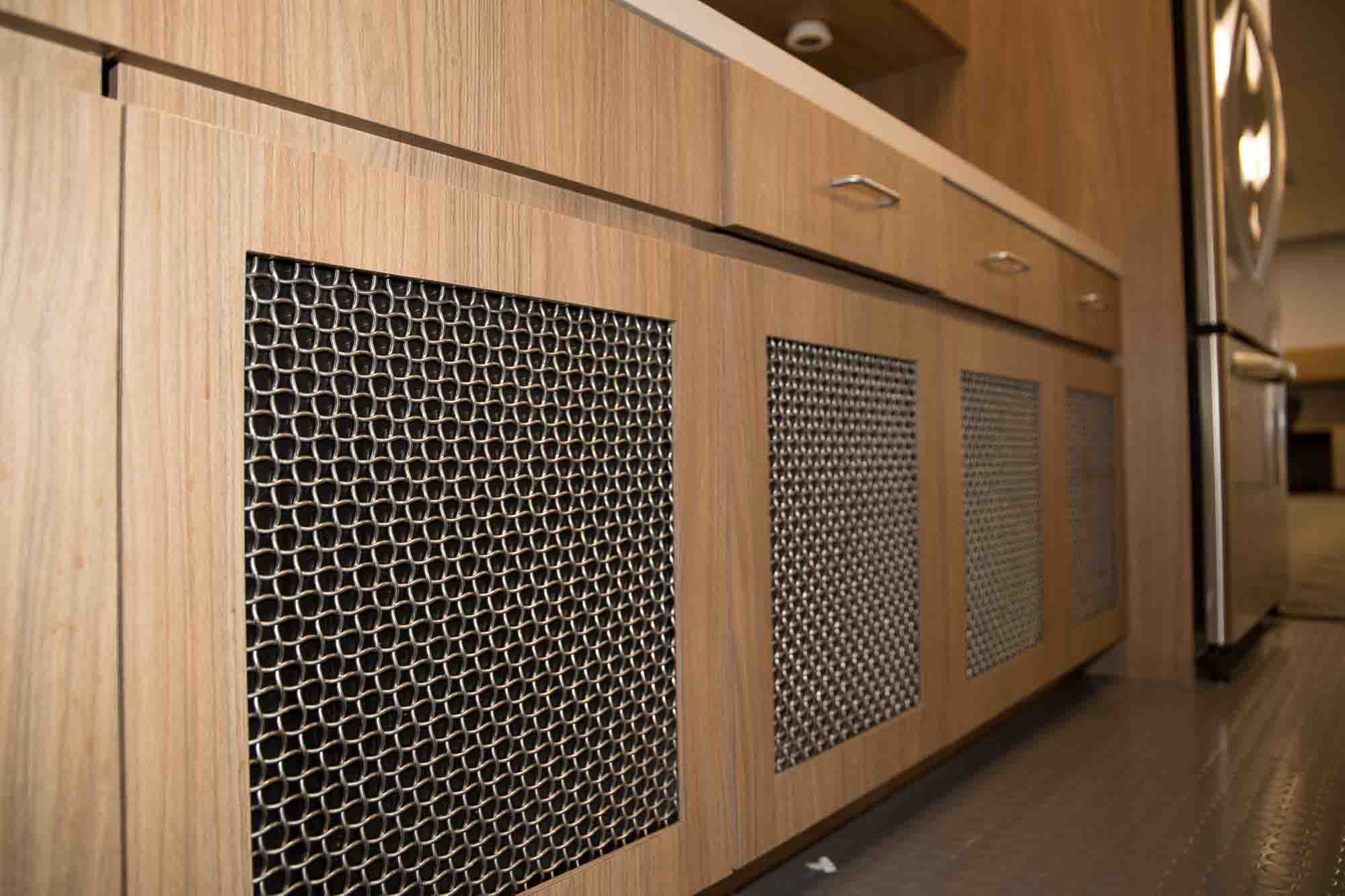 Woven Wire Mesh being used as inserts for wooden cabinets.
