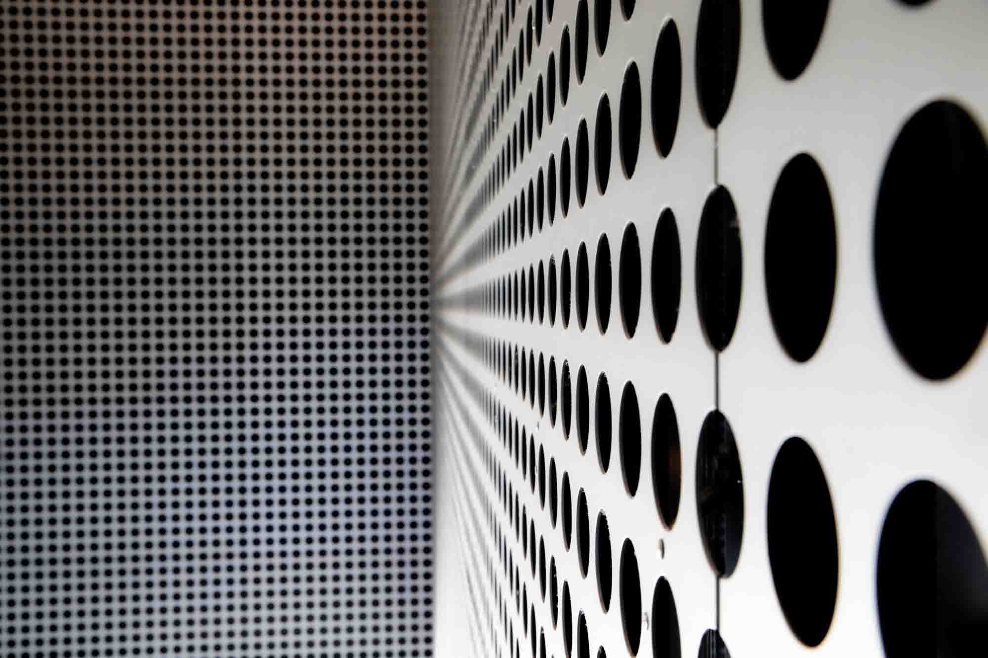 Artistic photo of Perforated Metal facade.
