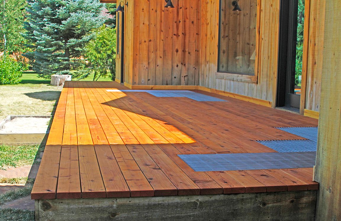A backyard deck made of wood and Bar Grating.