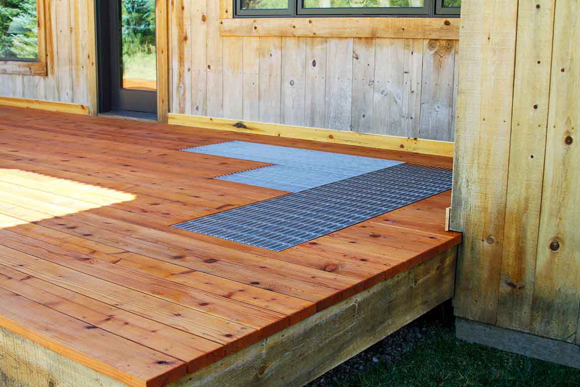 A wooden deck with strategically placed Bar Grating drains.