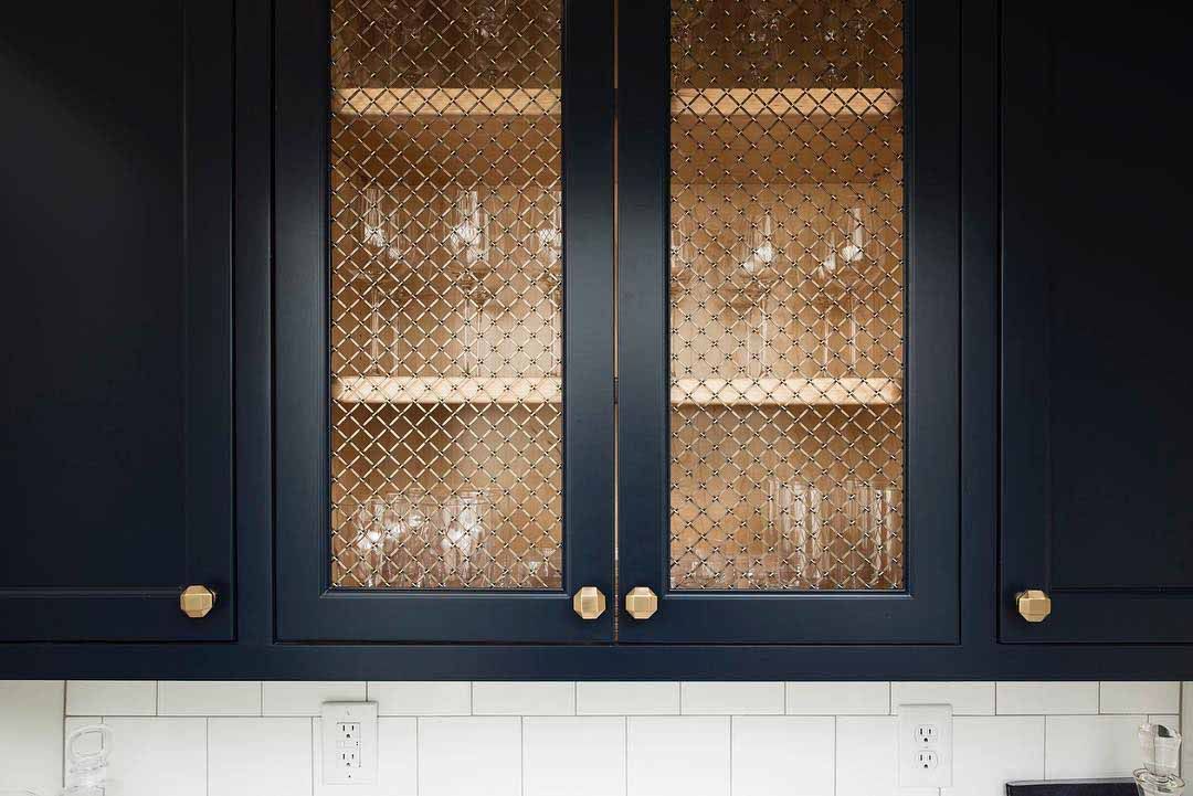 Designer Wire Mesh cabinet inserts in a kitchen.