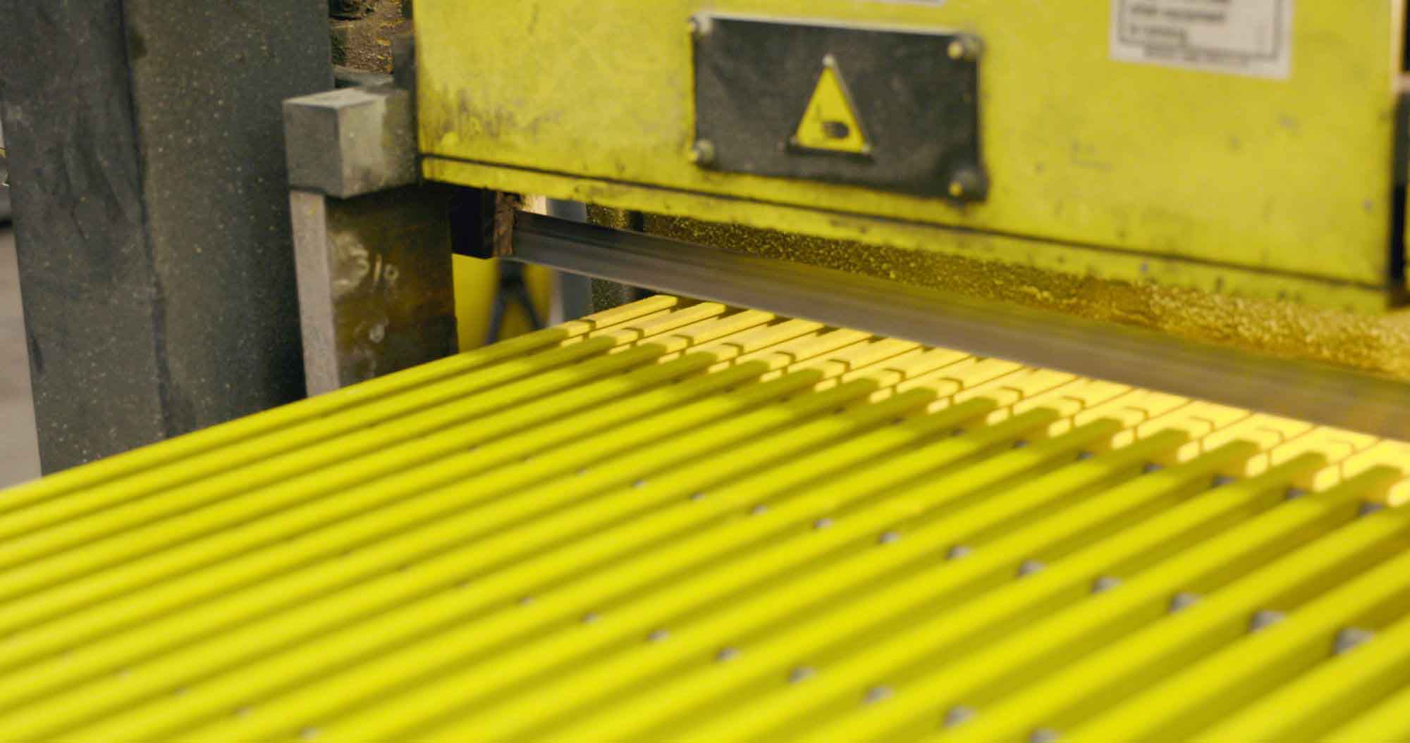 A closeup view of a saw about to cut into Fiberglass Grating.