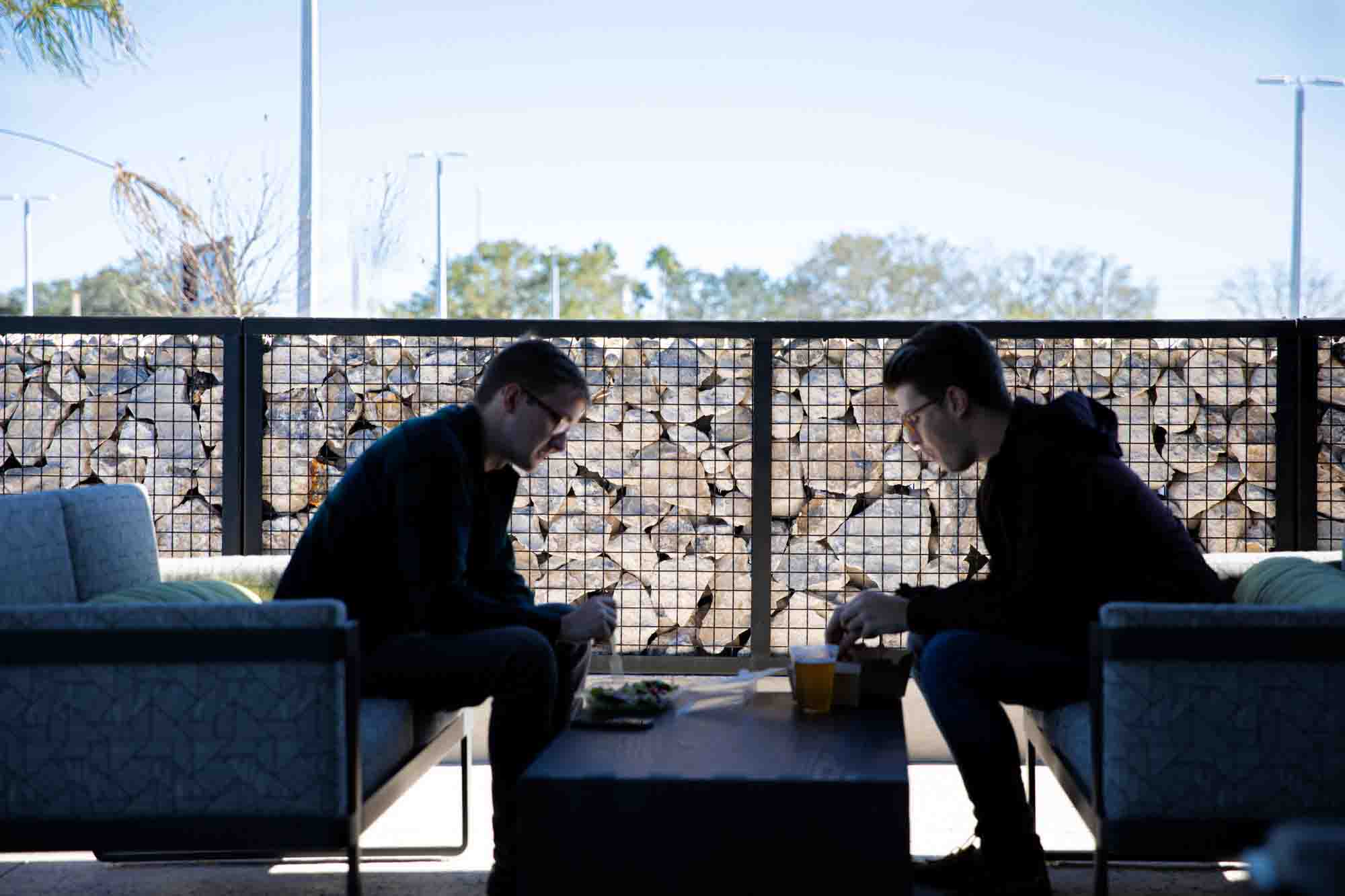 Two patrons dining on the patio behind the protection of ECO-ROCK® walls.