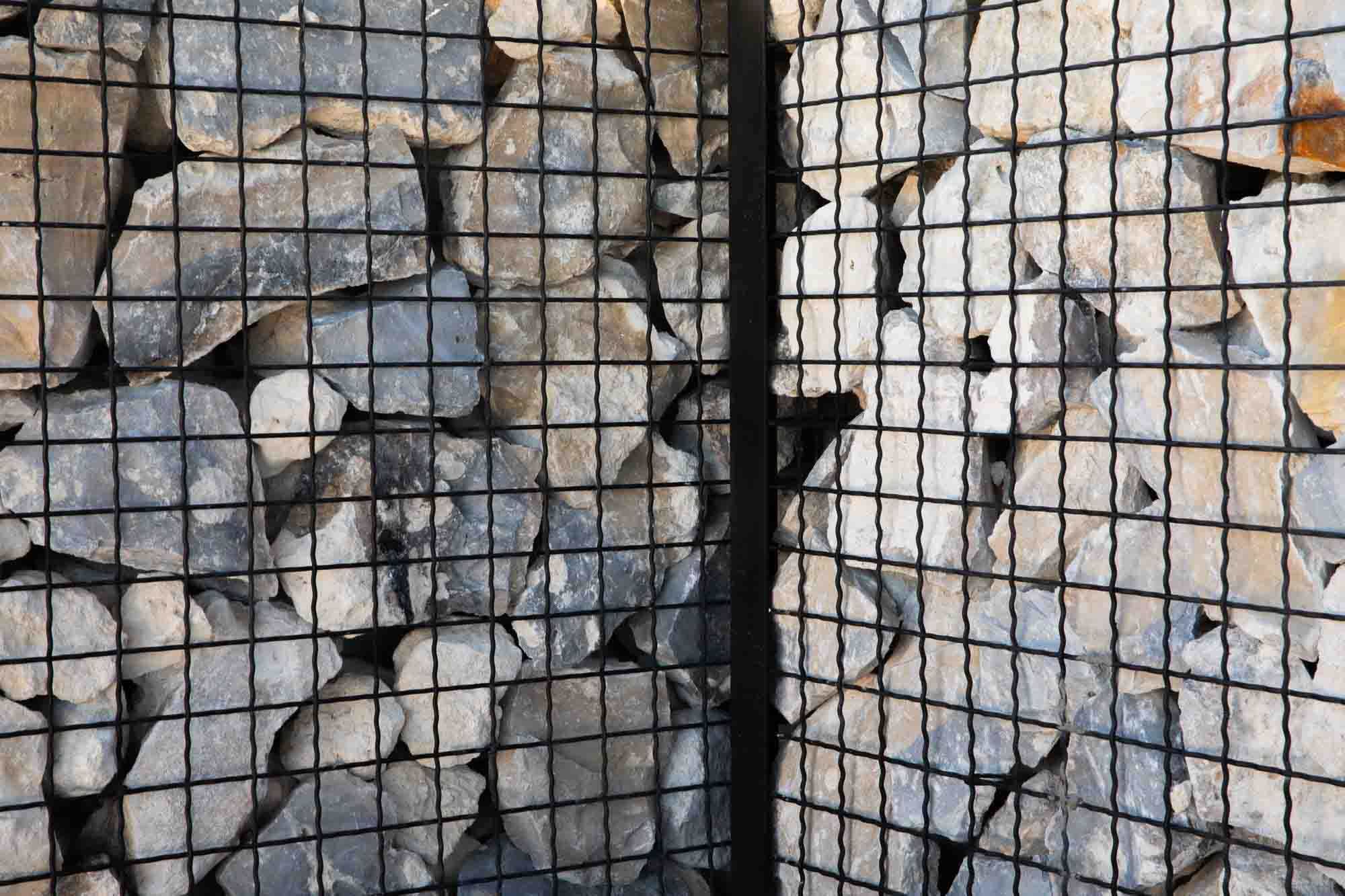 ECO-ROCK®, a type of Intercrimp Wire Mesh, forms a security barrier.