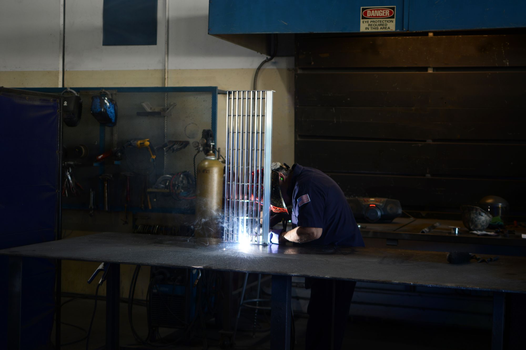 Hero image of a fabricator welding stair treads.