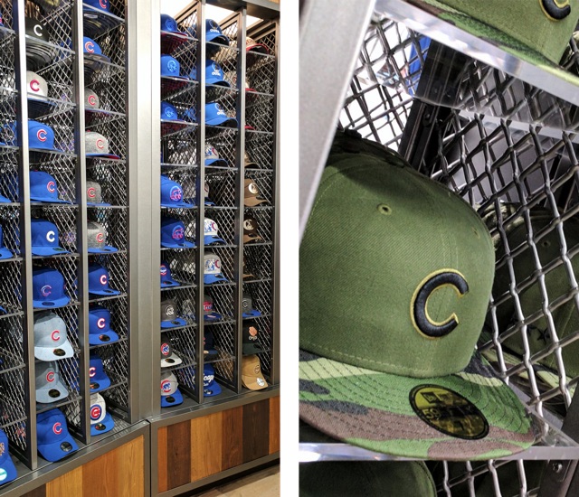 Rows of cubbies made of Wire Mesh, all filled with Chicago Cubs hats in the Team Store.