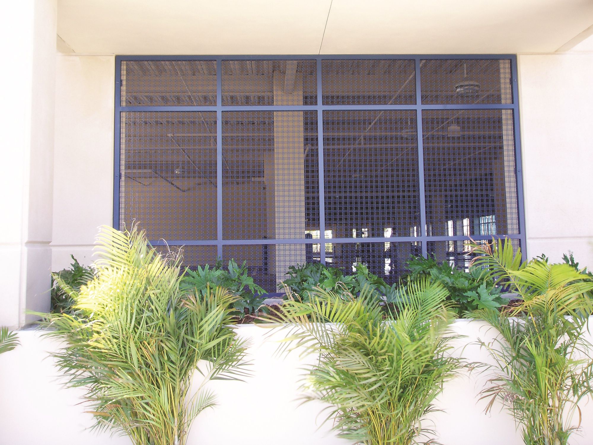 Infill Panels made out of Designer Wire Mesh used as security screens for an office garage.