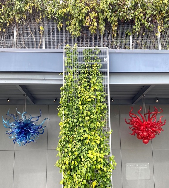 A tall ECO-MESH® panel with leaves and vines.