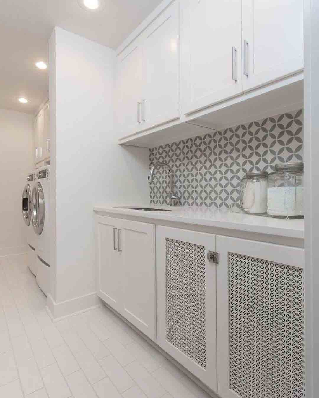 Designer Perforated Metal infill panels used as laundry room cabinet inserts.