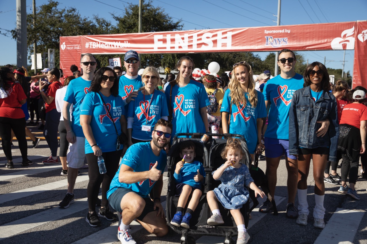 Associates, in the community, at the finish line of the 2023 AHA Heart Walk.