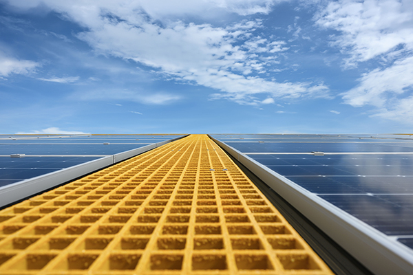 A long gangway made with yellow Molded Fiberglass Grating.
