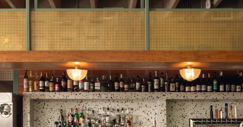 McNICHOLS® Designer Perforated Metal, OCTAGON CANE, used as decorative inserts above the bar area of a pizzeria.