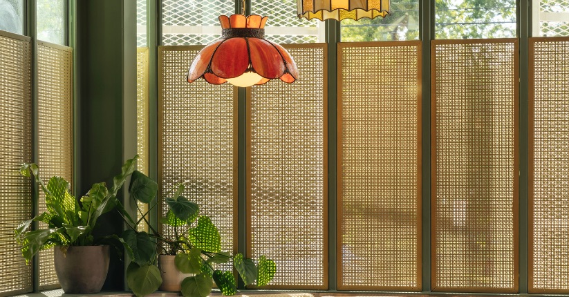 McNICHOLS® Designer Perforated Metal, OCTAGON CANE, used as decorative inserts in front of windows in a pizzeria.