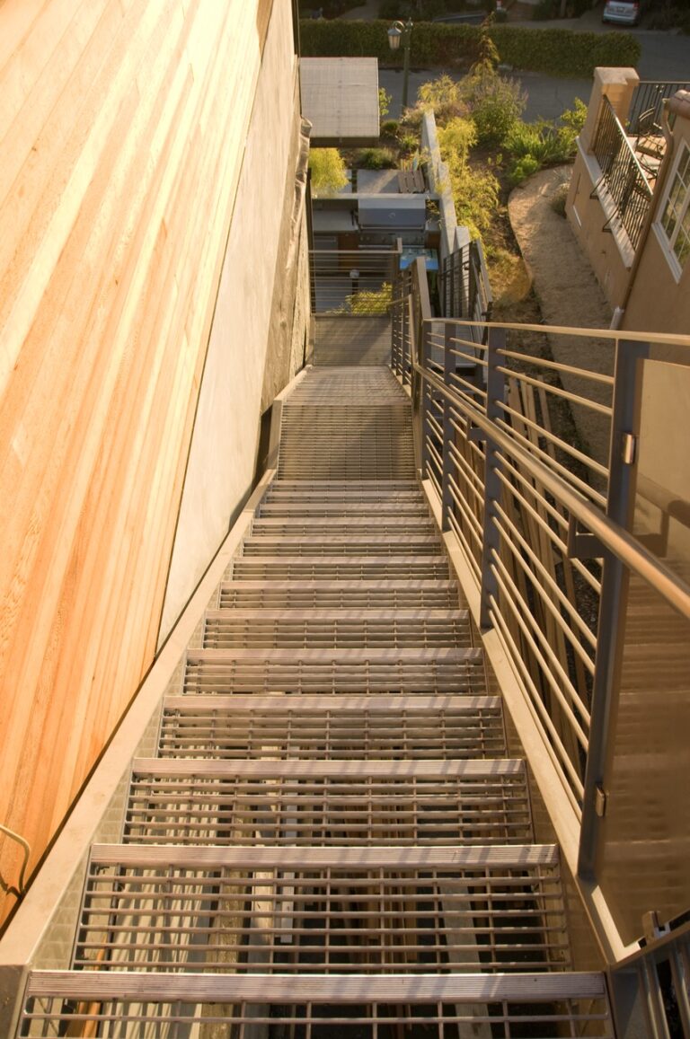 Smooth Swage-Locked Bar Grating Stair Treads at the Margarido House.