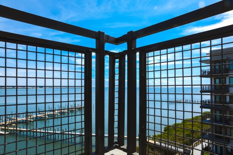 Close-up of black Square Wire Mesh with a Lock Crimp Weave used as balcony infill panels, overlooking Tampa Bay.
