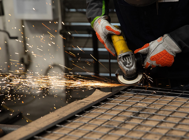 A McNICHOLS® Operations Associates smoothing out infill panel framing.