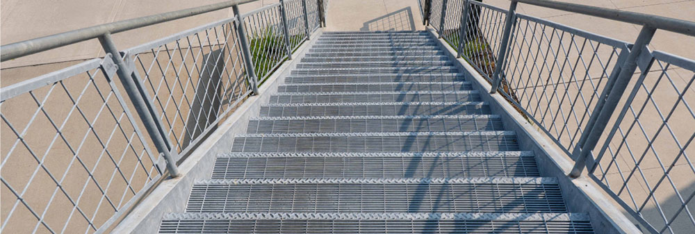 Stair Treads and Wire Mesh infill panels used together in a public area.