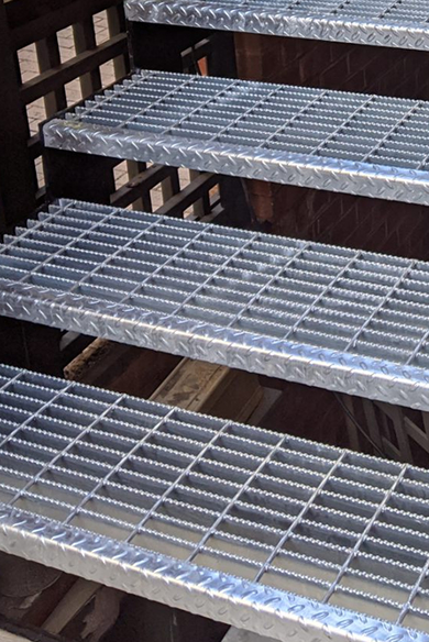 Serrated Bar Grating Stair Treads that have Nosing.