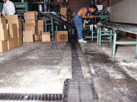 This distillery floor has been retrofitted with a Presloped Trench Drain.