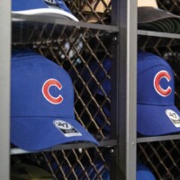 Chicago Cubs caps displayed on shelving that uses Square Wire Mesh with a Lock Crimp Weave in a team store setting.