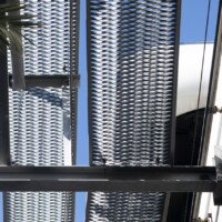 Underside view of elevated walkway showcasing 5-Diamond GRIP STRUT® Plank Grating and structural steel framing.