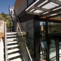 Smooth Aluminum Swage-Locked Bar Grating Stair Treads at the Margarido House.