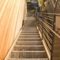 Smooth Swage-Locked Bar Grating Stair Treads at the Margarido House.