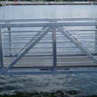 Pultruded Fiberglass Grating bridge over water.