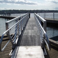 Pultruded Fiberglass Grating ramp over water.