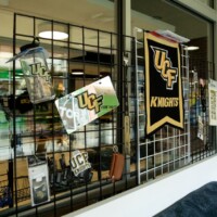 Retail display featuring Square Welded Wire Mesh holding UCF Knights merchandise in a storefront setting.