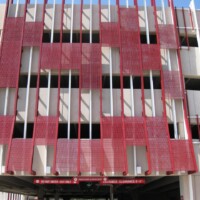 Red Molded Fiberglass Grating sunshades on a parking garage.