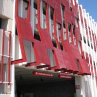 Red Molded Fiberglass Grating sunshades on a parking garage.