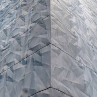 Close-up of Designer Expanded Metal, Flattened LANCET™ 31651-F facade at Walker Art Center in Minneapolis, MN, highlighting the angular seams and textured, faceted surface pattern.